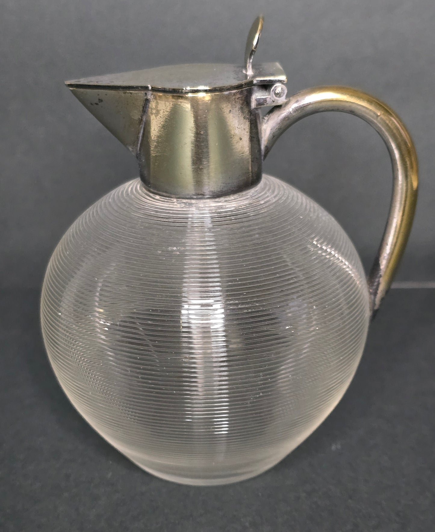 Mouth-blown Frisian thread glass jug with silver-plated handle 1910