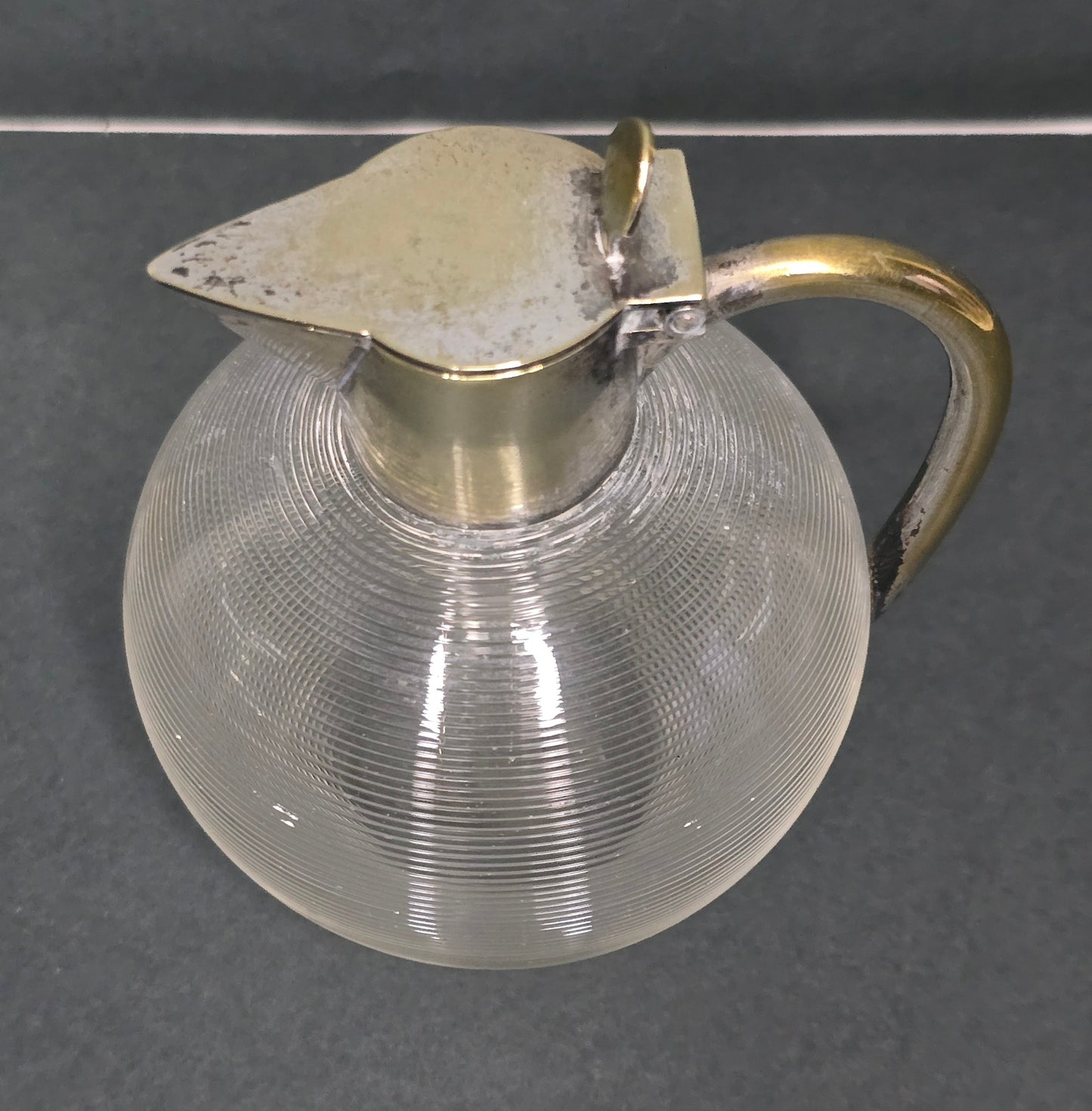 Mouth-blown Frisian thread glass jug with silver-plated handle 1910