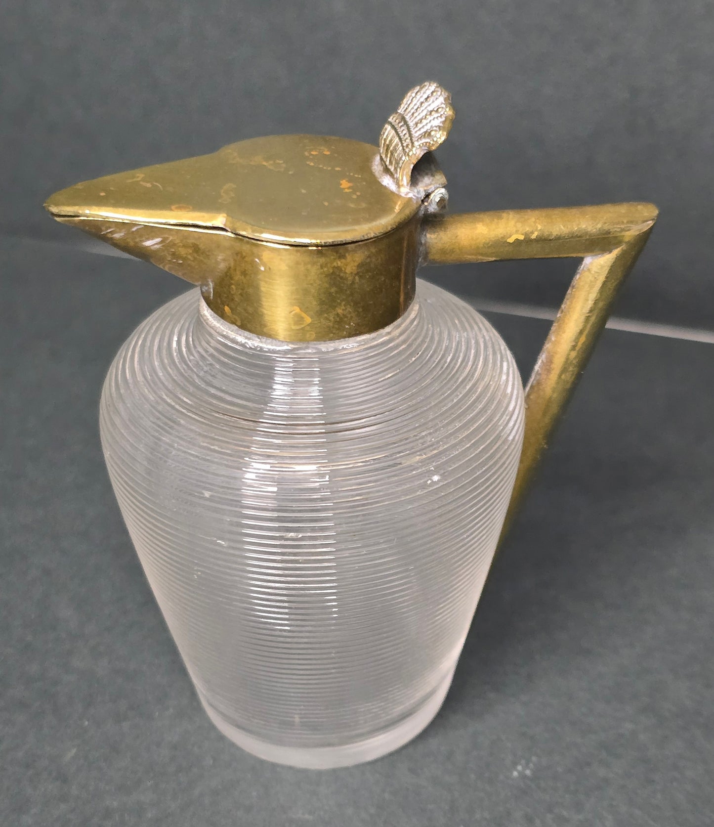 Mouth-blown Frisian thread glass milk jug with brass handle 1910
