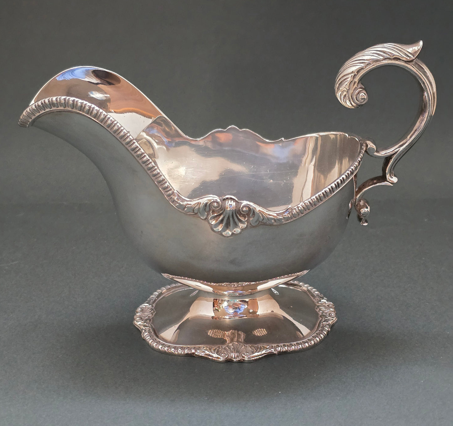 Antique Silver Sauce Boat on Pedestal with Dramatic Scroll Handle (circa 1840)
