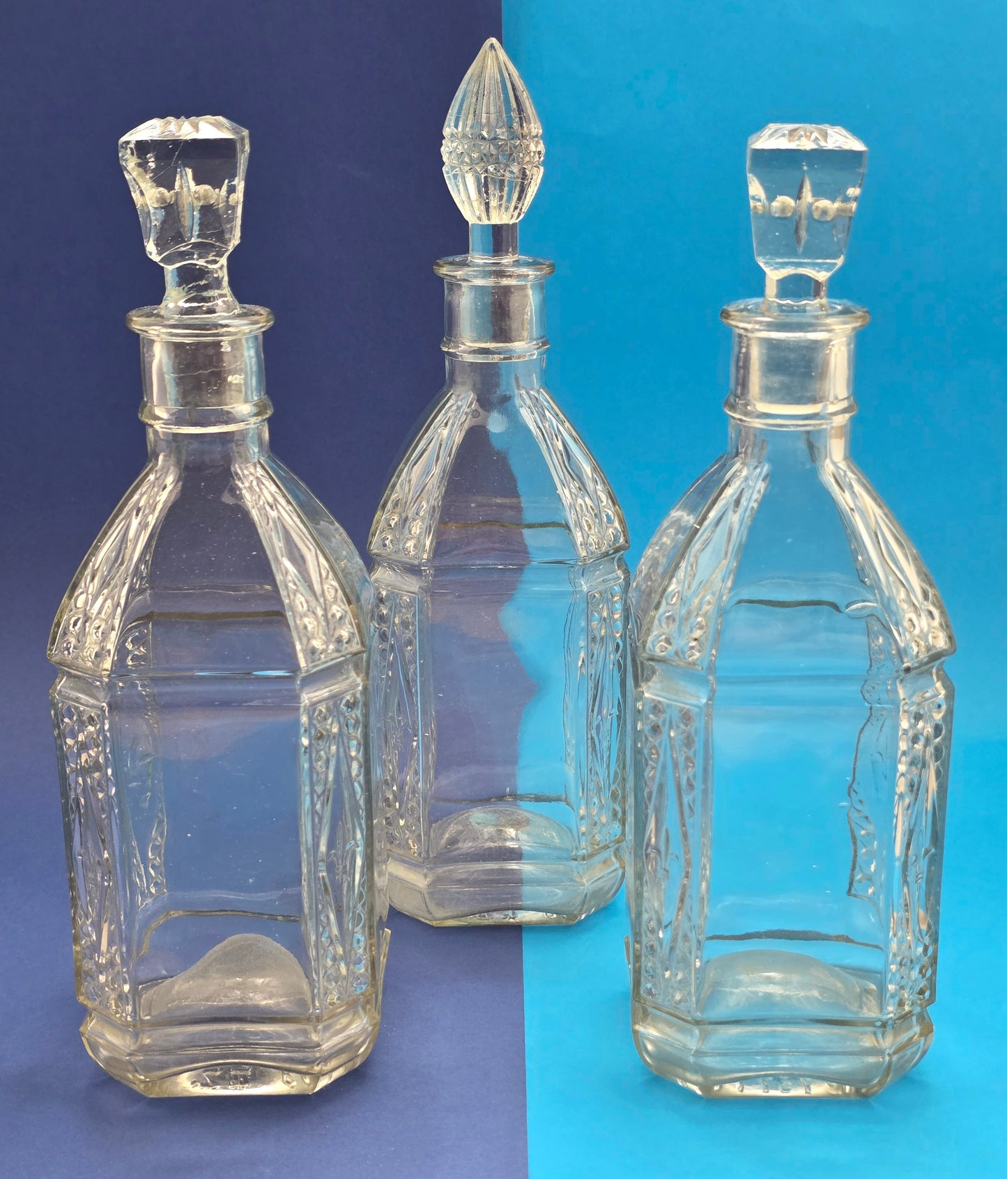 English pressed glass decanter c.1928 – three decanters overview