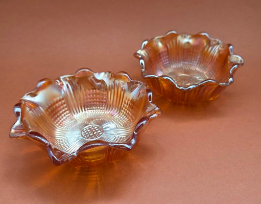 Marigold Carnival Glass berry bowls set of 2 – angled view showing iridescent lustre and ruffled scalloped rim